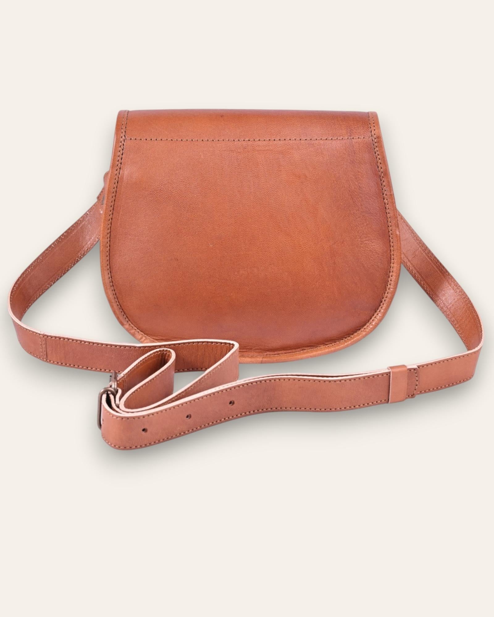 A real leather brown tan sling saddle bag for women and men
