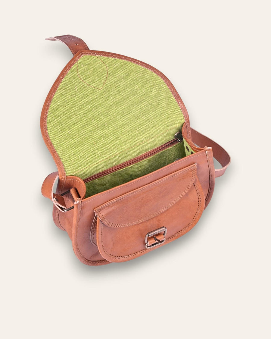 A real leather brown tan sling saddle bag for women and men