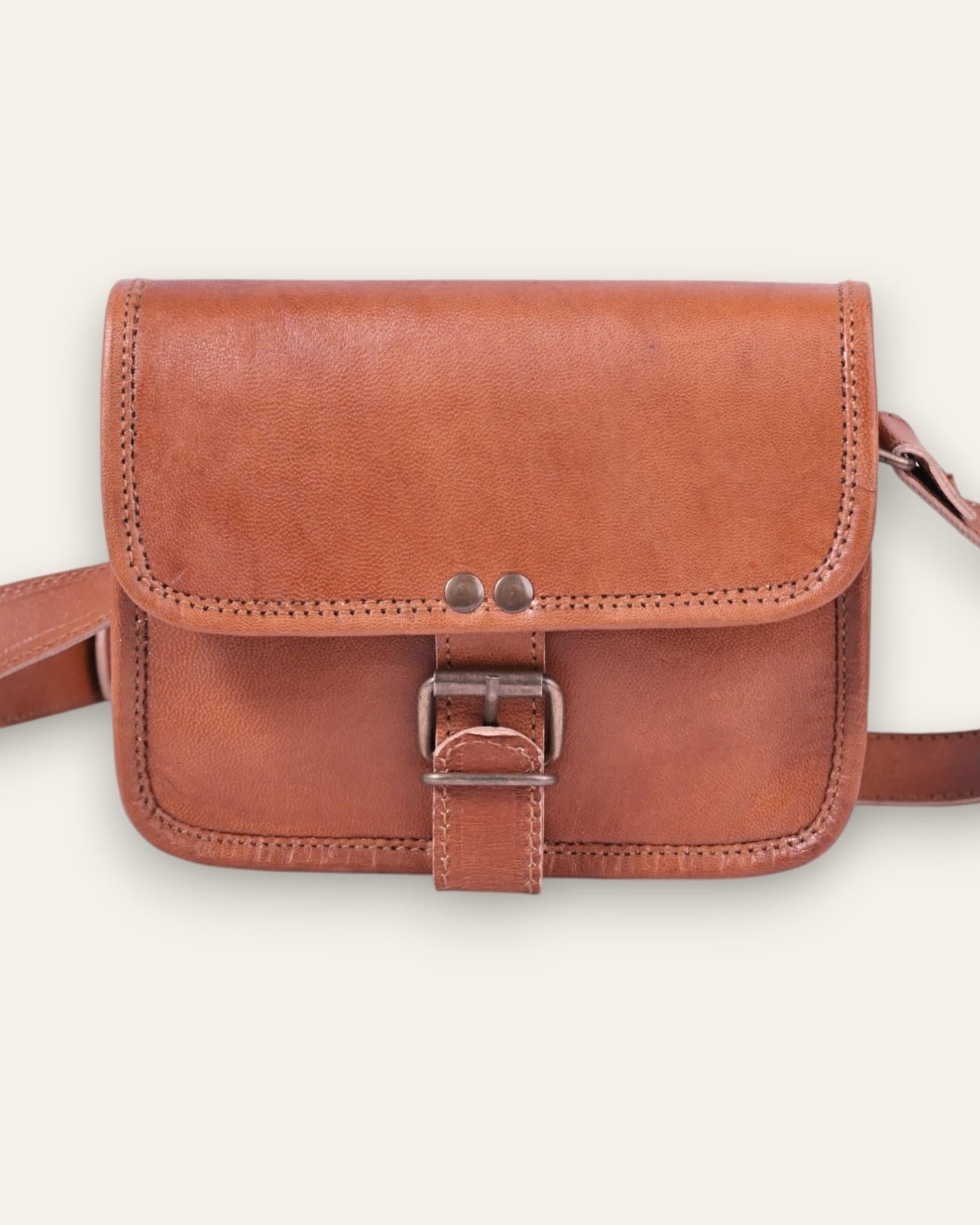 A mini real leather bag in tan color