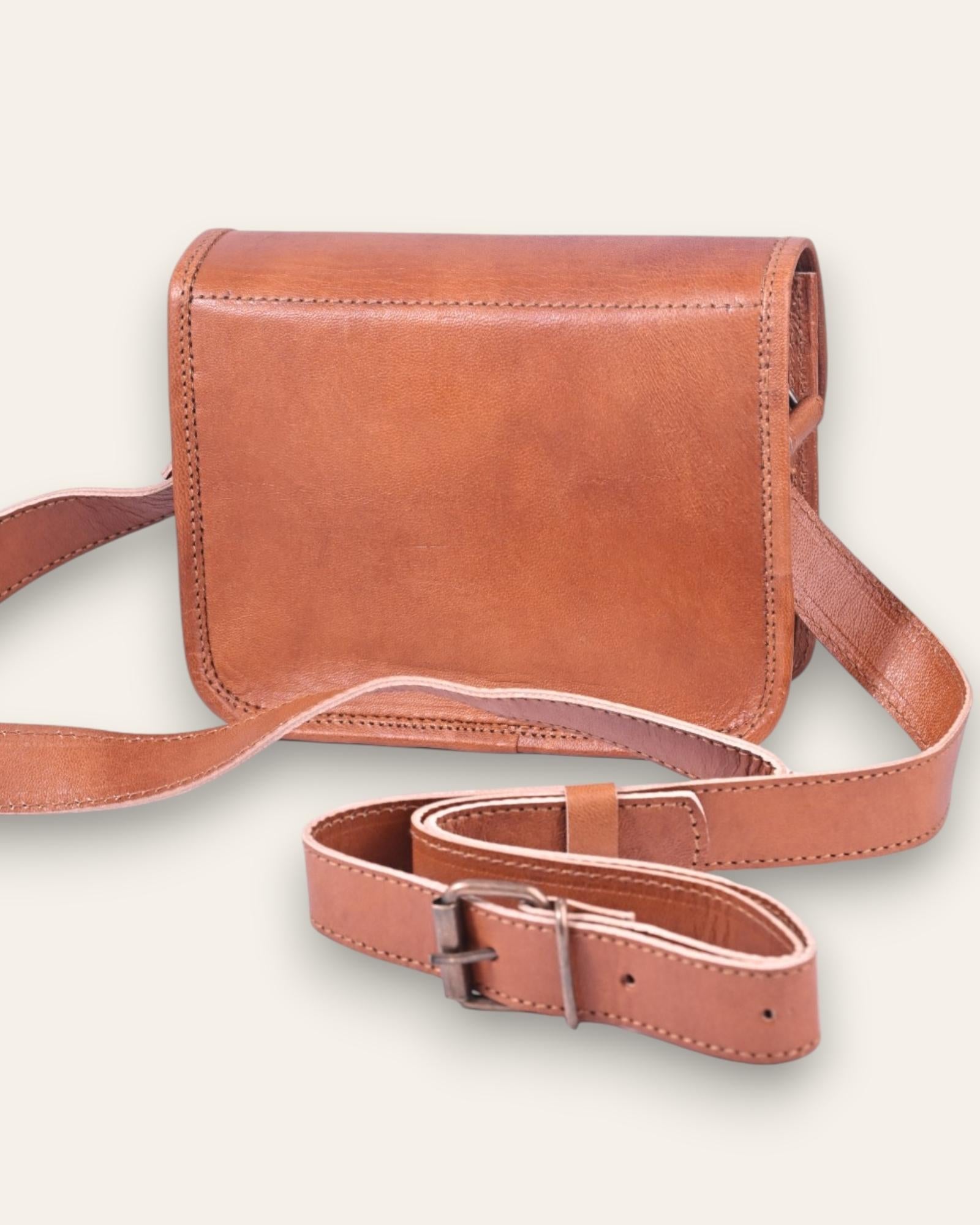 A mini real leather bag in tan color