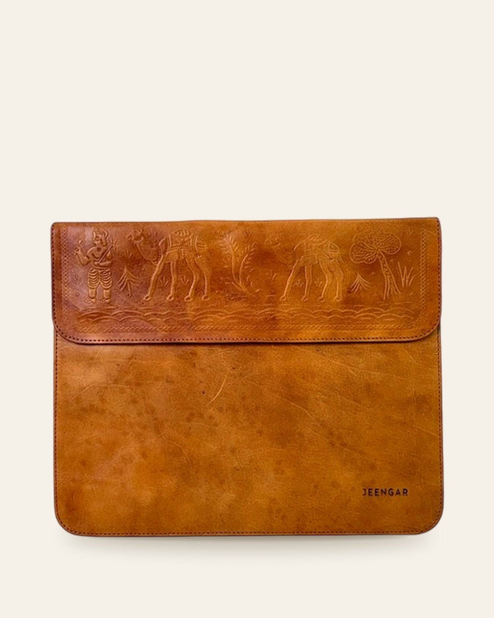 The Barmer Tech Sleeve (11-inch) in Tan — front with embossed camel caravan and JEENGAR stamp