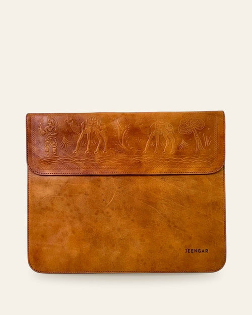 The Barmer Tech Sleeve (11-inch) in Tan — front with embossed camel caravan and JEENGAR stamp