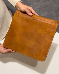 The Barmer Tech Sleeve, a handcrafted tan full-grain leather iPad and MacBook sleeve featuring a hand-embossed desert camel motif by Jeengar.