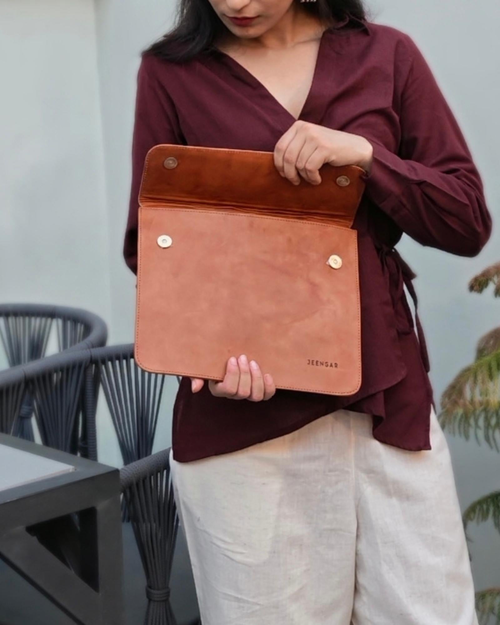 The Barmer Tech Sleeve, a handcrafted tan full-grain leather iPad and MacBook sleeve featuring a hand-embossed desert camel motif by Jeengar.