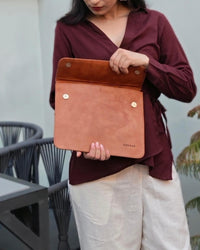 The Barmer Tech Sleeve, a handcrafted tan full-grain leather iPad and MacBook sleeve featuring a hand-embossed desert camel motif by Jeengar.