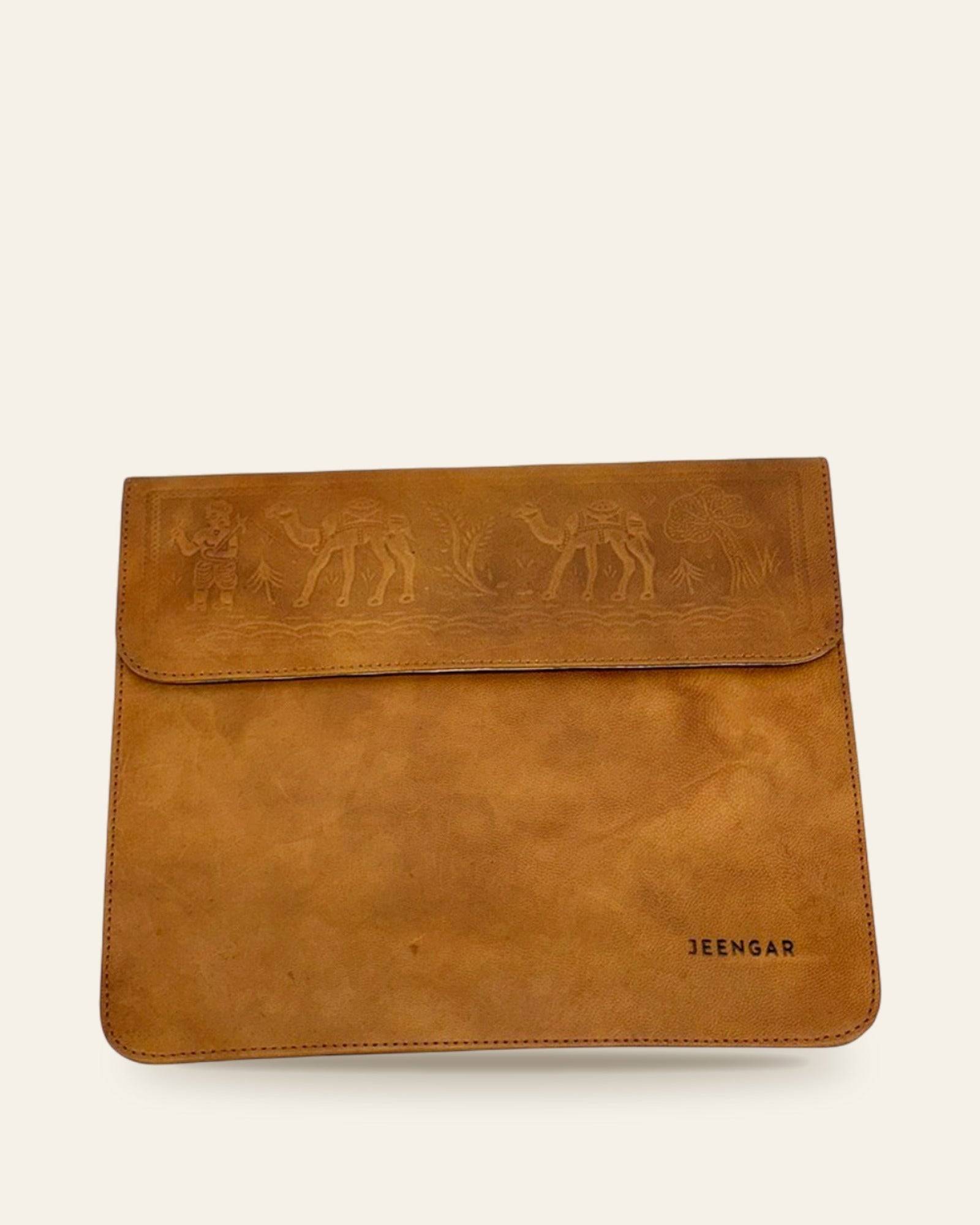 The Barmer Tech Sleeve (13-inch) in Tan — front with embossed camel caravan