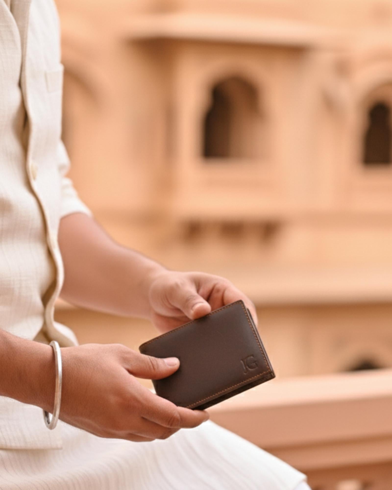 A real leather wallet with 2 cash compartments and a coin pocket